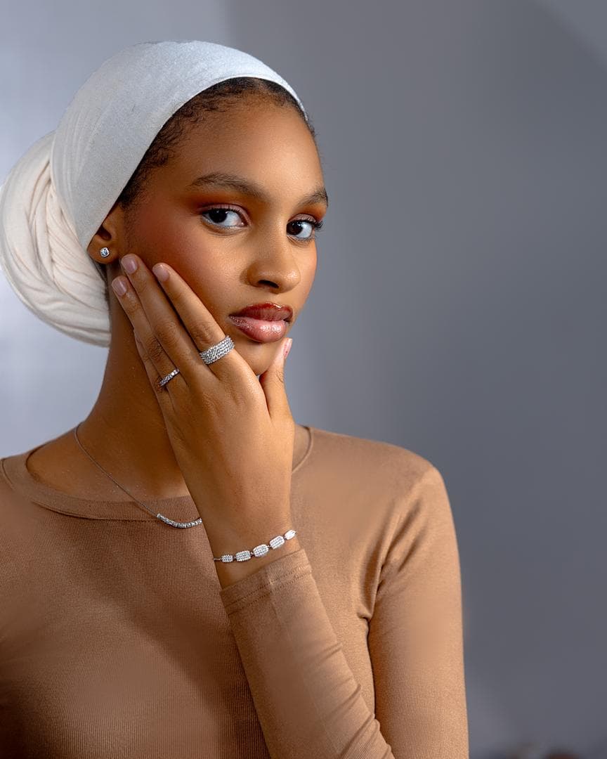 Model wearing Élan pavé studs, rings, necklace and bracelet