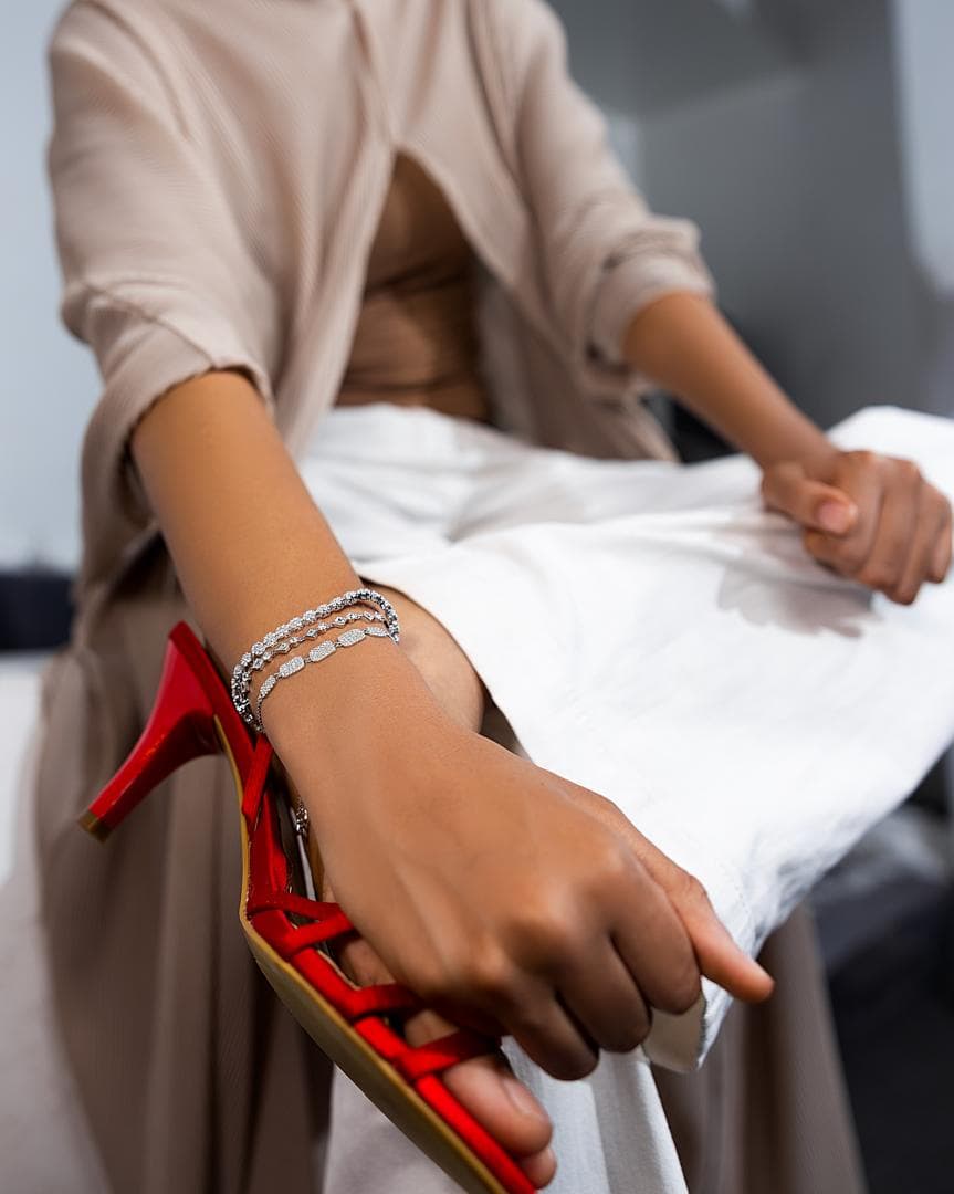 Stacked Élan diamond bracelets on the wrist